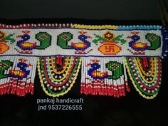 the beaded belt is decorated with colorful beads and birds on it's sides