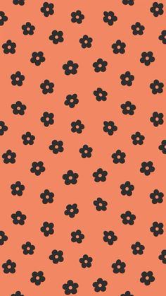 an orange background with black flowers and dots on the bottom right corner is a pattern that looks like it has been designed for wallpapered