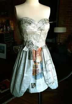 a dress made out of newspapers on a mannequin