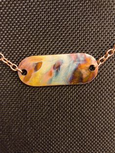 Fire-painted copper pendant with chain.  Each one is unique and actual necklace may look different than the photo. Artsy Hand Painted Copper Jewelry, Artistic Copper Pendant Necklace, Artistic Multicolor Copper Jewelry, Unique Multicolor Copper Necklace, Multicolor Copper Necklace, Fire Painting, Columbia Mo, Pendant With Chain, Copper Pendant