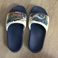 Brand New Condition And Never Worn Casual Navy Slides With Round Toe, Navy Round Toe Casual Slides, Casual Navy Round Toe Slides, Casual Blue Slides For Streetwear, Vans Custom Sporty Sneakers For Skateboarding, Blue Vans Skate Shoes For Sports, Vans Custom Sneakers For Skateboarding, Blue Vans Skate Shoes, Blue Vans Sneakers For Skateboarding