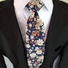 Treat yourself with a new pattern and splash of color to your look with this unique tie. 100% Cotton Handmade Package Includes: Slim Tie Length: 57" Width: 2.6" Warm iron if needed Blue Floral Print Suit And Tie Accessories For Business, Fitted Blue Floral Suit And Tie Accessories, Multicolor Ties For Spring Black Tie Events, Multicolor Ties For Black Tie Events In Spring, Blue Standard Tie For Spring, Blue Floral Print Suit And Tie Accessories For Spring, Casual Blue Ties For Spring, Spring Blue Floral Print Suit And Tie Accessories, Blue Floral Print Tie As Gift