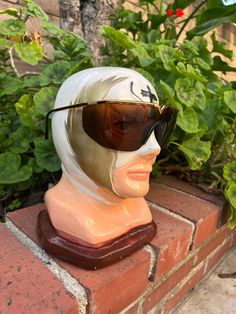 Brown and gold vintage Gianna Versace shield sun glasses made in Italy 1980s The unisex Versace S90 frame measures approximately 5.5" temple to temple with the unique one-piece polycarbonate lens stretching the entire width of the frame plus the side shields condition is good with a imperfections pictured Gold Aviator Shield Sunglasses With Uv Protection, Retro Gold Sunglasses With Mirrored Lenses, Gold Retro Sunglasses With Mirrored Lenses, Retro Gold Sunglasses With Uv Protection, Gold Retro Sunglasses With Uv Protection, Retro Brown Shield Sunglasses With Mirrored Lenses, Retro Gold Aviator Sunglasses With Mirrored Lenses, Vintage Aviator Shield Sunglasses With Uva Protection, Retro Shield Sunglasses With Uv Protection