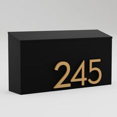 a black and gold box with the number twenty five on it's front side