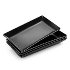 four black plates stacked on top of each other