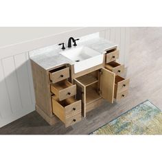 a white sink sitting next to a wooden cabinet with drawers on it's sides