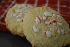 two cookies with white and red sprinkles on top