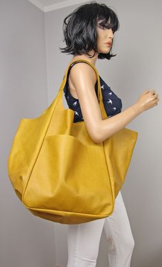 "Very large handbag,  Double Handle Soft Large Tote with Pocket, Yellow Large tote bag It is good to have at least one large leather handbag in which you can put all the necessary things. The bag is very light and soft. Made of Italian grain leather. This oversized bag has been carefully designed to be the perfect everyday bag. The size makes it practical for carrying everyday little things. Made from 100 percent Italian leather. This bag is available in different colors, check in my store.   * Full grain leather handbag with a slight sheen * Includes two large internal pockets for mobile phone and other small items. * Top closure magnet for security. Height: 39 cm / 15.3\" Height from top of handle to base: 68 cm / 26.8\" Handle drop: 26 cm / 10.2\" Width: 34 - 74 cm / 13.4\" - 29.1\" Dep Yellow Leather Bag, Large Shopper Bag, Large Leather Handbags, Large Handbag, Oversized Bag, Large Handbags, Yellow Leather, Large Tote Bag, Shopper Bag