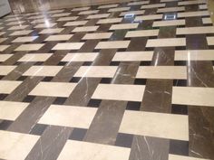 a tiled floor with black and white squares on it