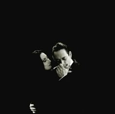 a man and woman kissing in front of a black background with the quote to live without you, only that would be torture