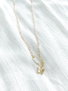 Gold plated pendants. Gold plated paperclip chain. 18.5" in length Gold Paperclip Clavicle Chain Necklace, Trendy Gold Paperclip Necklace, Dainty Paperclip Chain Link Charm Necklaces, Dainty Charm Necklaces With Paperclip Chain, Dainty Paperclip Chain Link Charm Necklace, White Snake Chain Necklace With Adjustable Chain, Trendy Gold Plated Dangle Necklaces, Gift Clavicle Chain Necklace With Paperclip Shape, Gift Paperclip Clavicle Chain Necklace