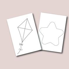 two blank cards with an image of a star and a kite on them, one has a string attached to it