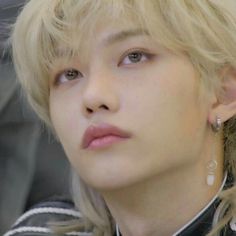 a close up of a person with blonde hair