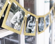 an old photo hanging on a clothes line in front of a window with gold glitter