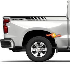 the rear end of a white truck with silverrod decals on it's side