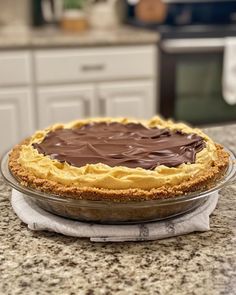 a chocolate pie sitting on top of a kitchen counter