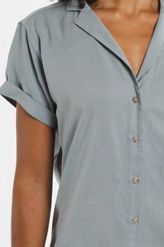 Flattering and versatile, meet your new go-to top The Innes is a short-sleeve button-up with a relaxed silhouette. Design details like a lapel collar and rolled sleeves mix modern design with a classic look. Just add a sweater and a great pair of pants or skirt, and this lightweight top is ready to be dressed up or down throughout the seasons. 90% Tencel, 10% Linen Relaxed fit button-up Lapel collar Short cuffed sleeves Machine wash cold, line dry only. Do not tumble dry, do not bleach. (Tag on Workwear Shirt With Rolled Sleeves And Camp Collar, Short Sleeve Button-up Shirt With Rolled Sleeves For Work, Everyday Collared Shirt With Rolled Sleeves, Relaxed Fit Rolled Sleeves Short Sleeve Shirt For Work, Collared Shirt With Rolled Sleeves For Everyday, Effortless Collared Shirt With Rolled Sleeves, Classic Short Sleeve Work Shirt With Rolled Sleeves, Classic Workwear Short Sleeve Shirt With Rolled Sleeves, Classic Short Sleeve Shirt With Roll-up Sleeves