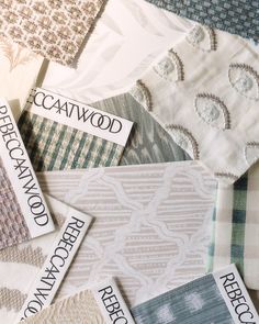 many different types of fabric samples are stacked on top of each other, with the words catwood printed on them