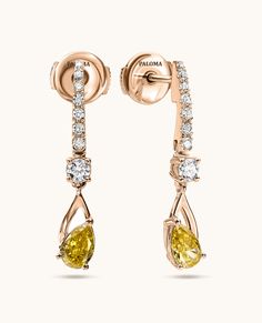 Elegant and timeless, these single-drop earrings feature two fancy yellow diamonds gracefully hanging from a gold bar adorned with pave diamonds. They effortlessly elevate an everyday style or add a touch of glamour to any special occasion. Luxury Yellow Gold Earrings For Wedding, Luxury Yellow Gold Earrings With Intricate Design, Unique Luxury Yellow Earrings, Luxury Gold Danglers With Pierced Details, Luxury Gold-plated Gold Danglers, Luxury Yellow Gold Linear Earrings For Wedding, Luxury Yellow Diamond Drop Earrings, Yellow Diamond Earrings For Formal Occasions, Formal Yellow Diamond Earrings