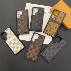 five louis vuitton phone cases sitting next to each other on top of a table