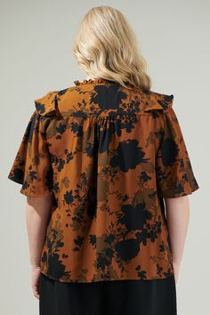 Elevate those everyday outfits when you add the Sandy Floral Ruffle Blouse to your wardrobe! This blouse boasts a chic floral print throughout, shaping flutter short sleeves with a split neckline and some ruffles. You can wear it with any shorts or pants and tuck it in or leave as is and achieve a cute fit! - Split neck- Flutter sleeves- Ruffles- Relaxed fit- Color: Brown BlackSize + Fit - Model is 5'9" and wearing size 2X- Measurements taken from size 2X- Chest: 29"- Length: 29" Fabric Self:100 Cute Fit, Floral Ruffle, Flutter Sleeves, Flutter Sleeve, Everyday Outfits, Ruffles, Fitness Models, Ruffle Blouse, Floral Print