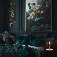 a bed with green comforter and pillows in a dark room next to a painting on the wall