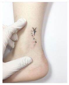 a person with a small tattoo on their foot