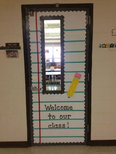 a classroom door decorated with school supplies and the words welcome to our class on it