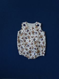 This cool and comfortable little romper is easy on and off.  Fully lined. White Cotton Jumpsuits For Playtime, White Cotton Jumpsuits And Rompers For Playtime, Cute White Jumpsuit For The Beach, Summer Cotton Jumpsuits And Rompers For Vacation, Casual Bubble Romper For Spring Playdates, Casual Cotton Bubble Romper For Beach, Casual Spring Bubble Romper For Playdate, Summer Cotton Onesie For Playwear, Summer Cotton Bubble Romper For Playdate