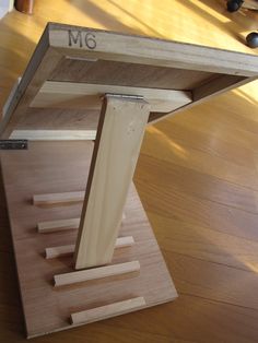 a close up of a wooden table on a hard wood floor