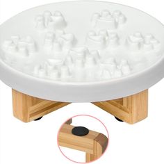 a large white tray with lots of ice cubes on it and a wooden base