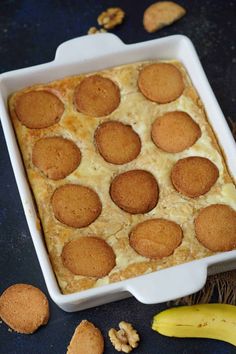 a casserole dish filled with baked food on top of a blue table cloth