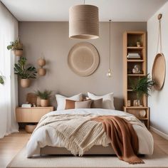 a bedroom with a large bed and lots of potted plants