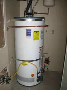 a water heater in the corner of a room