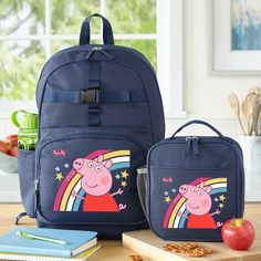 Durable, functional and oh-so-colorful, this charming design brings a hint of oink-tastic whimsy to school days and other outings. Plenty of pockets to hold all their essentials and ultra-comfy shoulder straps. NEW GEAR, NEW YEAR: For back to school! This personalized gear is sure to take them to the head of the class. It has tons of space for all the essentials any student needs for the day. Suitable for ages 3+. UNIQUELY PERSONALIZED: Make the grade! Select backpack or backpack/lunchbox set. C Playful Rectangular Backpack For Back To School, Navy Blue Backpack, Rainbow Backpack, Ridge Wallet, Tumbler Pictures, Personalized Memorial Gifts, Special Kids, Blue Backpack, School Bags For Kids