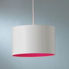 a white and pink lamp hanging from a ceiling