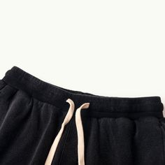 Baggy Cotton Black Cargo Shorts Beach - Raw Edge Helms - The baggy black cargo shorts are instantly eye-catching in the urban setting. Carefully crafted from 320GSM high-quality combed cotton with a breathable French Terry interior, these comfy shorts are tailored to a laid-back fit with design details that make them stand out from other cargo shorts. The side accordion pockets provide functionality and a structured look, while the distressed hem adds a rugged and edgy touch that contrasts perfe Black Cargo Shorts, Raglan Hoodie, Streetwear Accessories, Urban Setting, Black Cargo, French Terry Fabric, Comfy Shorts, American Express, Zip Sweatshirt