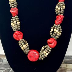 🌼 Red and gray wood beaded necklace with red stone accents and lobster claw clasp. 🌼 Measures: 27" long. 🌼 Condition: very good, minimal wear. Please see all photos for complete details. For more vintage jewelry in my shop, please visit: https://www.etsy.com/shop/TheVintageDaisyVault?ref=seller-platform-mcnav§ion_id=25440304 Red Artisan Beads With Natural Stones, Artisan Red Beads With Natural Stones, Red Coral Beaded Necklaces With Wooden Beads, Artisan Red Natural Stone Beads, Red Coral Beaded Necklace With Wooden Beads, Artisan Red Necklace With Wooden Beads, Green Beaded Necklace, Chunky Statement Necklace, Wood Bead Necklace