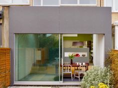 the outside of a house with sliding glass doors