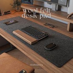 a computer desk with a keyboard and mouse on it