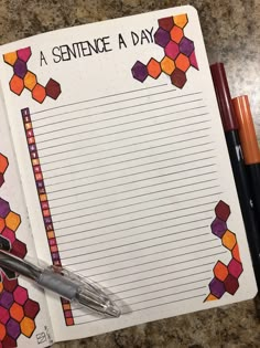 a notepad with writing on it next to two pens