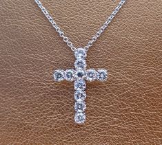 "This 18k white gold pendant is a high quality cross. This cross pendant is 19.5mm height by 13.75mm width made in 18k white gold. It has 11 quality diamonds VS2 clarity and H color range Approximately 3/4 cts total weight. The 18k white gold chain can be 16,17 or 18 inch long . This cross is made to order We love these pendant because it represents the way jewelry should be made with craftsmanship and quality. This pendent is anything but ordinary. Our pieces are designed and made with craftsma Simple Cross Necklace Gold, Peacock Lamp, Flower Wedding Band, Cross Necklace Simple, Dark Green Fabric, Simple Cross, Van Nuys, White Gold Pendant, Gold Cross Necklace