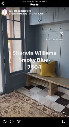 an image of a room with blue walls and wood furniture on the floor in front of a window