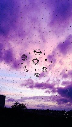 the sky is purple and blue with stars, planets, and other things in it