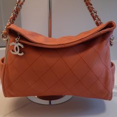 Authentic, Super Soft Leather On This Fold Over Bag With Zip Closure!! Peach Is The Spring Color For 2024. Bag Has A Few Rubs/Dirt Marks, As Shown In Photos, Mostly On Bottom. Immaculate Interior, Silver Hardware. Great Used Condition! Comes In A Chanel Dust Bag High-end Pink Leather Shoulder Bag, Pink Leather Bags For Everyday Luxury, Designer Pink Shoulder Bag For Everyday Luxury, Luxury Pink Pouch-shaped Satchel, Luxury Pink Pouch Satchel, Leather Flap Bag With Dust Bag For Shopping, Designer Soft Leather Pouch Shoulder Bag, Designer Soft Leather Shoulder Bag For Everyday Luxury, Designer Pouch Flap Bag For Shopping