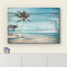 an ocean scene with palm trees on the beach and blue sky in the background canvas wall art print