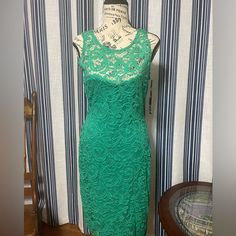 Pretty Green Lace Dress With See Though Decolatage And Upper Back. Never Worn Great Quality And Condition. Sleeveless Green Lace Midi Dress, Elegant Green Sleeveless Lace Dress, Green Lace Midi Dress For Garden Party, Green Sleeveless Lace Party Dress, Green Fitted Lace Midi Dress, Fitted Green Midi Lace Dress, Green Lace Dress For Date Night, Green Lace Sheath Dress, Green Lace Dress