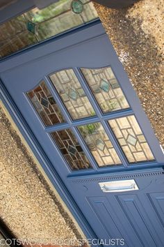 a blue door with stained glass on it