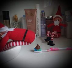 a toothbrush, santa clause doll and other personal care items