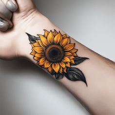 a yellow sunflower tattoo on the arm